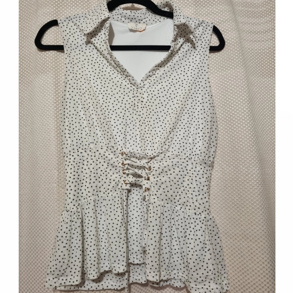 Elegant White and Black Sleeveless Peplum Blouse